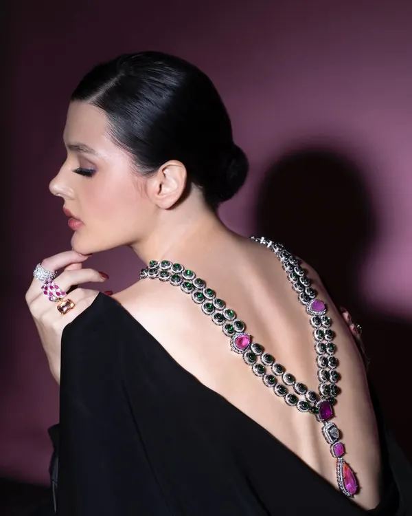 A dramatic back shot from a creative photoshoot. I styled this look to showcase how a necklace can be worn in an unconventional way, draping it down the back of a backless dress to create a unique and breathtaking statement.