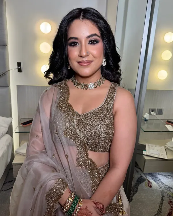 This look was all about making her the center of attention at her cocktail party. I created a classic smokey eye with a sharp wing and paired it with a flawless, dewy base and voluminous, textured waves.