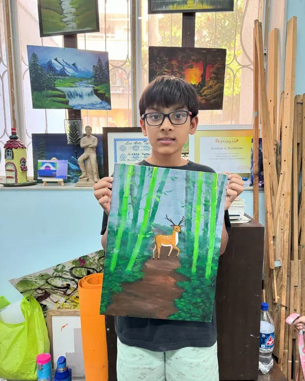 This peaceful forest scene was created using a special 'blur technique' on canvas. This method helps children learn about creating depth and atmosphere in their paintings.