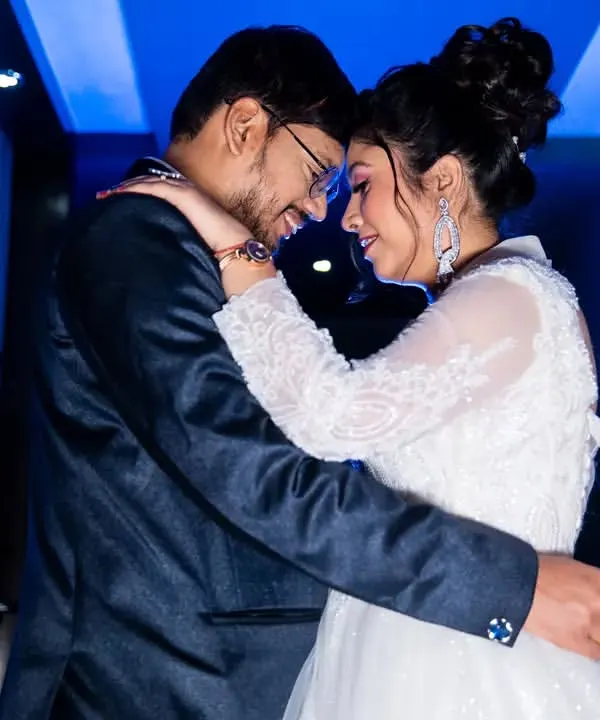 A stylish, cinematic shot from a Catholic wedding reception. We use creative lighting and composition to add a touch of modern artistry to your wedding album, telling your story with elegance.