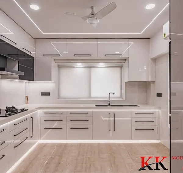 This is what we do best: create a masterpiece for your home. This stunning, all-white modular kitchen combines an anti-scratch acrylic mirror finish with premium Blum hardware. Notice the flawless integration of appliances and the ambient lighting that creates a space that is both functional and breathtakingly elegant.