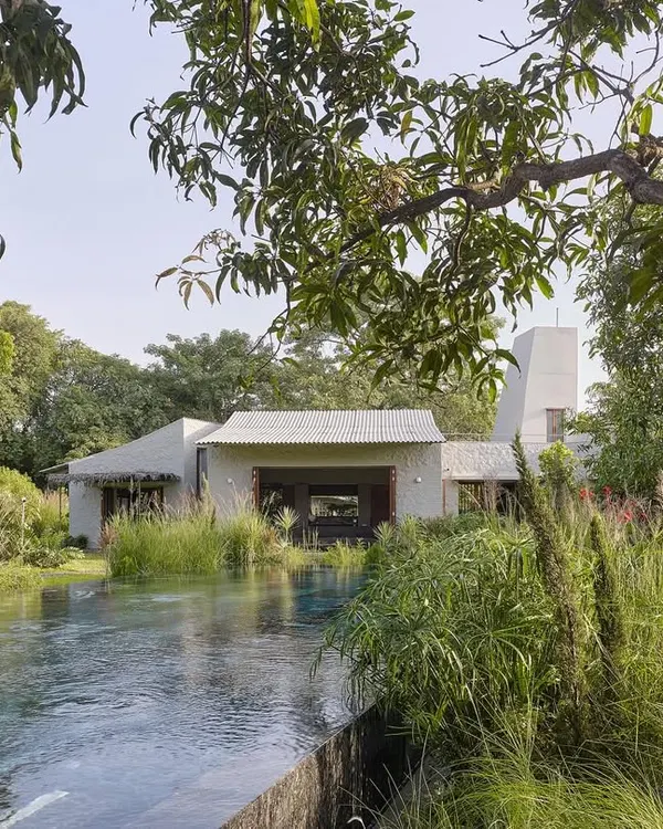 We believe a home should feel like it has grown from the land itself. For Villa Uma in Alibaug, we designed a collection of simple forms around an introverted garden and a linear pool, creating a tranquil sanctuary that responds to the picturesque views of the distant Kankeshwar hills.