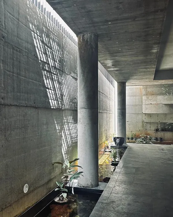 A study in how a narrow sliver of overhead light can animate a simple concrete corridor. The light reflects off the water channel below, creating a dynamic and ever-changing environment that engages the senses.