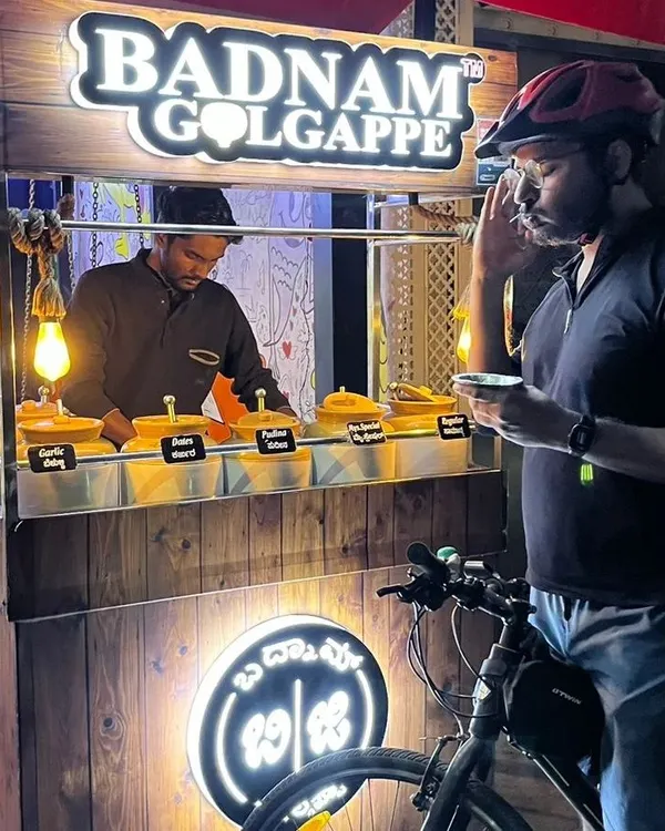 A pit stop at 'Badnam Golgappe' for some delicious pani puri with six different flavors of water. Discovering new food spots is a tasty perk of our night rides.
