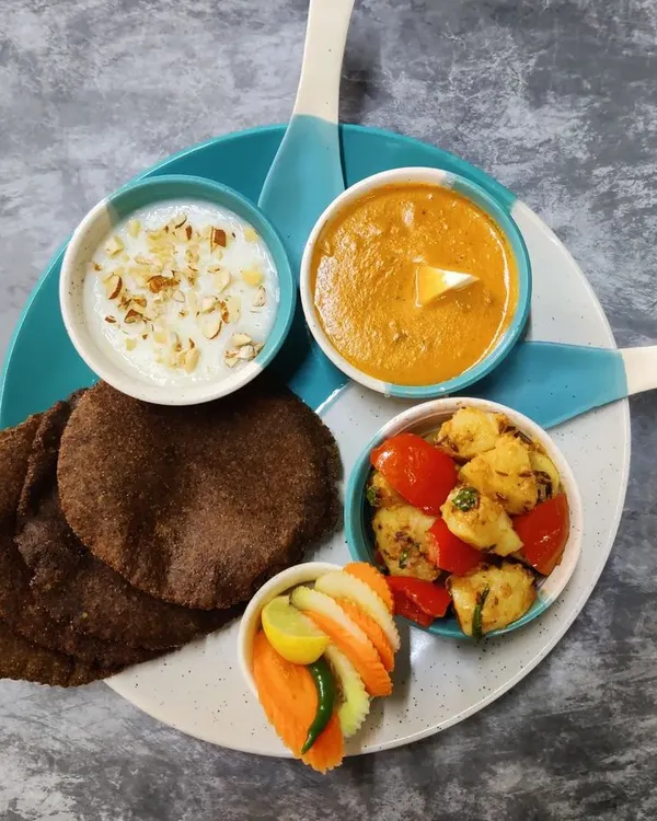 My special Navratri thali, prepared without onion or garlic. It includes Kuttu ki Puri, Vrat wale Aloo, and a creamy sabudana kheer for a complete fasting meal.