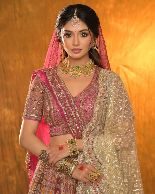 A blushing beauty in pink from a recent creative shoot. This look features a full glam style with a focus on a flawless base and defined eyes, perfect for a destination wedding vibe.