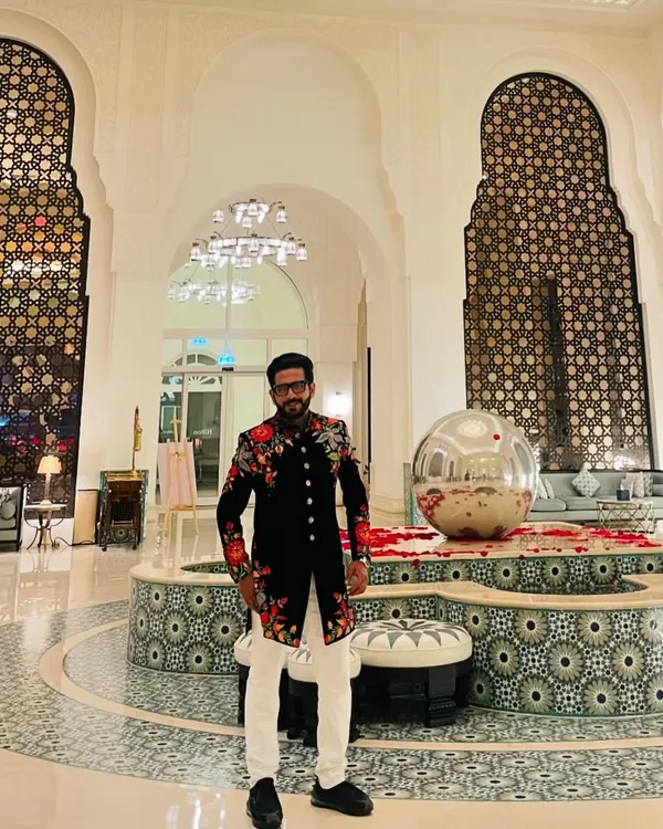 For a 'Shaam-E-Sufiyana' in Qatar, this black floral sherwani set the perfect tone of elegance and artistry. The intricate embroidery reflects the soulful vibe of the evening.