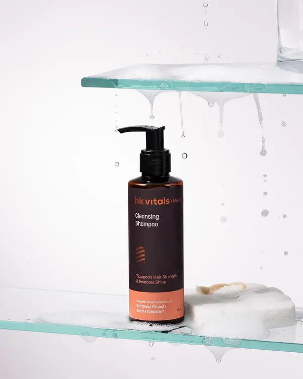 This shot is all about texture and the feeling of a refreshing lather. We used glass shelves and cascading soap suds to create a clean, bathroom-like environment that highlights the shampoo's cleansing power.