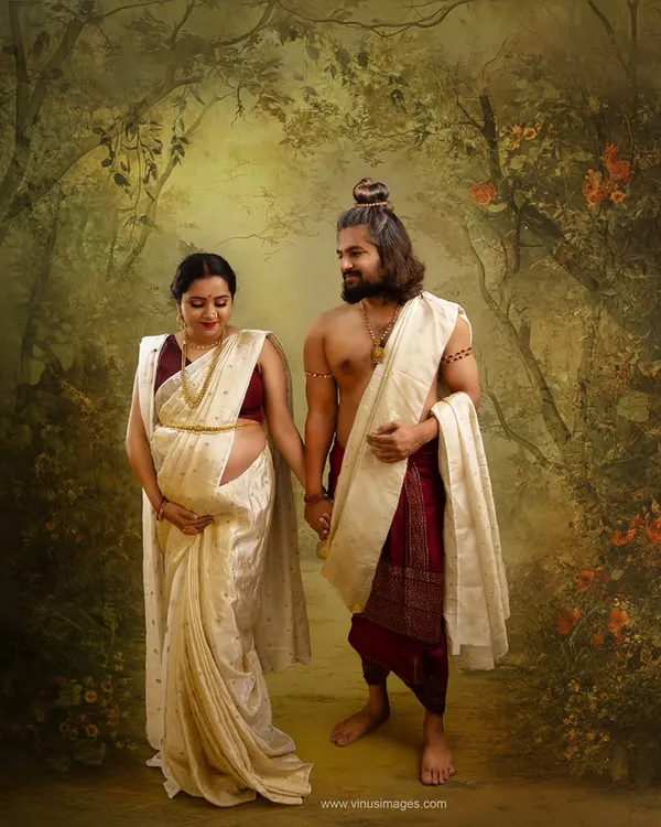 A portrait that tells an epic story. This Ram-Sita inspired couple's maternity photo captures a timeless narrative of love and devotion, set against a painterly, mythological forest backdrop.