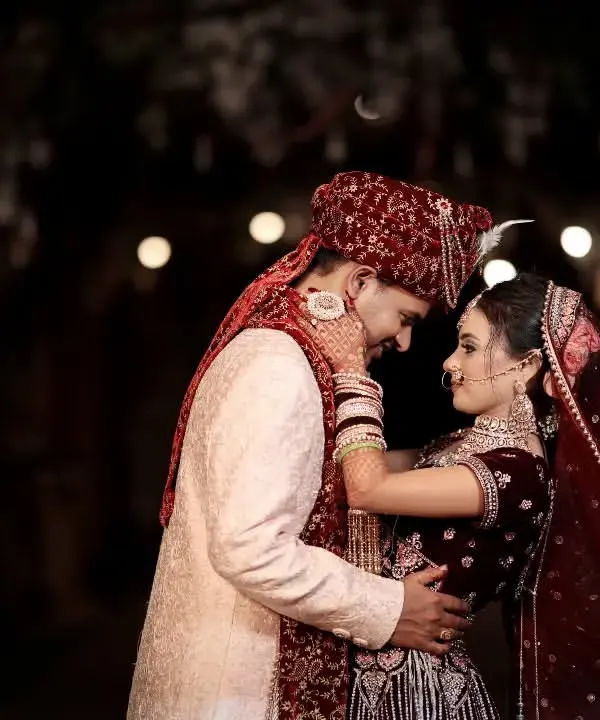 A quiet moment between the bride and groom on their wedding day, captured in a warm, romantic light. This is the kind of candid intimacy I love to find amidst the grand celebrations, focusing on the couple's connection.