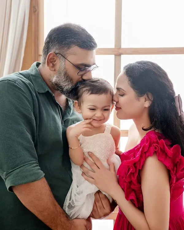 This is the kind of magic I strive to capture. A quiet, unposed moment where a mother and father's love for their child fills the entire frame. It’s a simple, honest family portrait that tells a beautiful story.
