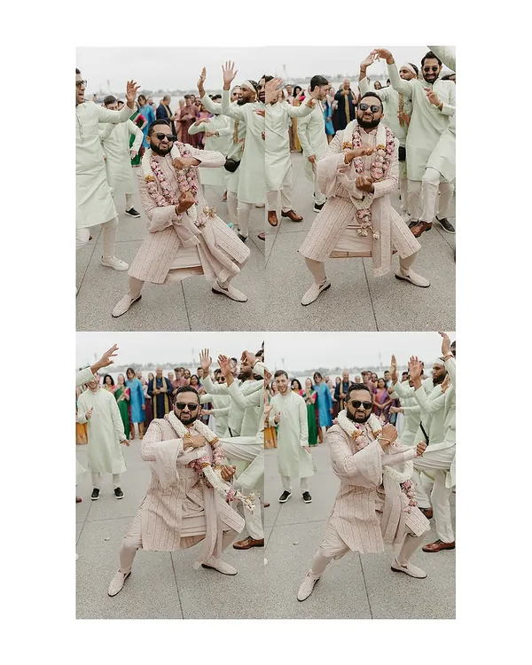The groom's entrance should be full of energy and style. Here, Aakash dances with his groomsmen, all styled by us. His blush pink striped sherwani stands out beautifully against the groomsmen's coordinated mint green kurtas, creating a look that is both fun and fashionable for the Baraat.