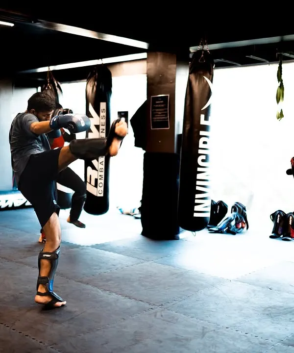 A group of young fighters practicing their kicks in a synchronized drill. Repetition is the mother of skill, and here we build muscle memory for powerful and accurate strikes.