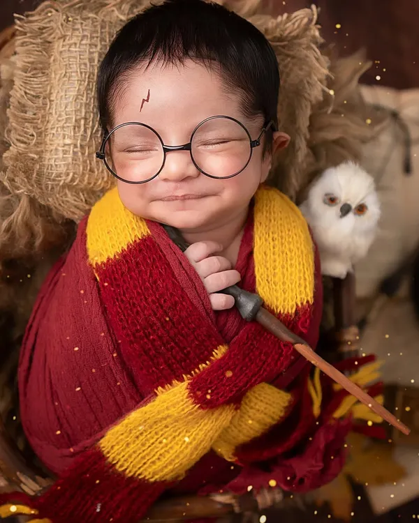 The boy who smiled. This little wizard's magical grin is the best special effect we could ask for in our Harry Potter-themed newborn setup.