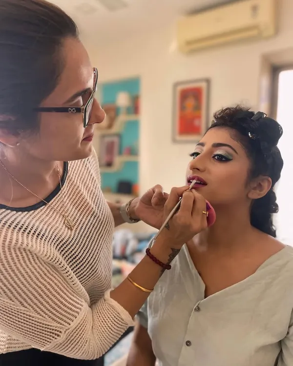 Creating a beautiful look for this client's engagement party. Here, I am applying the final touches to her lip color, completing a glamorous yet elegant makeup style perfect for celebrating a special milestone.