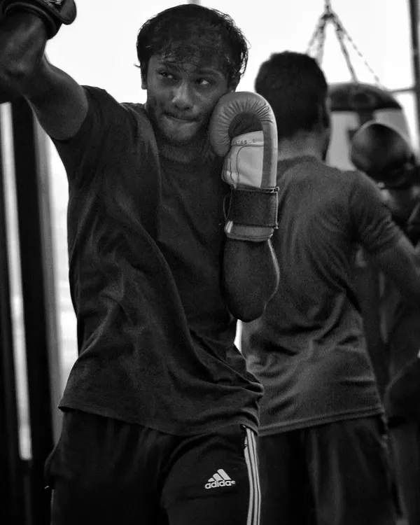 Working the heavy bag is about more than just power. It's about rhythm, footwork, and endurance. Every punch is a story of sweat and grit.