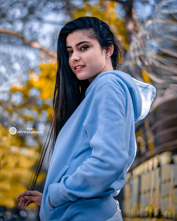 A bright, youthful portrait taken outdoors. The vibrant colors and happy expression make this a perfect example of a lifestyle shoot.
