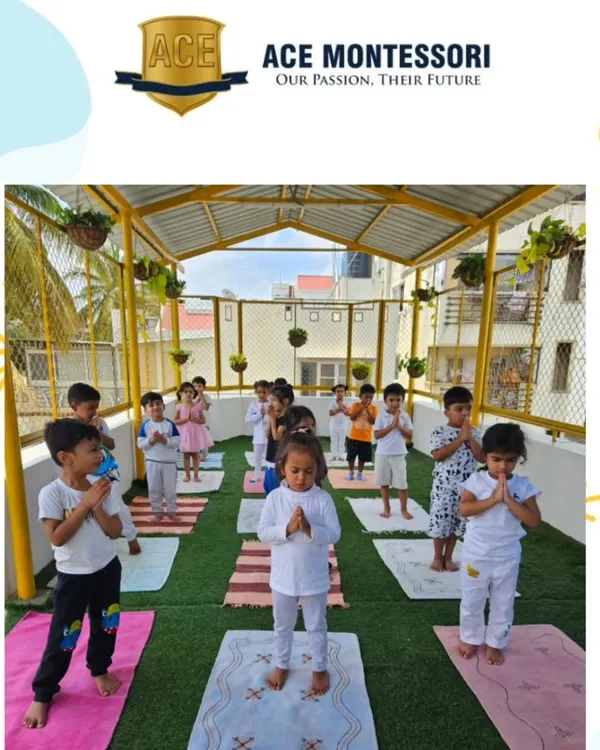 A group of children stand in a prayer pose during our yoga session. We teach them simple poses and breathing exercises to promote calmness and body awareness.