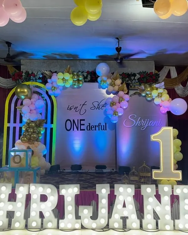 A full view of the "ONEderful" first birthday party stage we set up in Matunga. The large marquee letters, custom backdrop, and balloon decorations create a grand and festive look.
