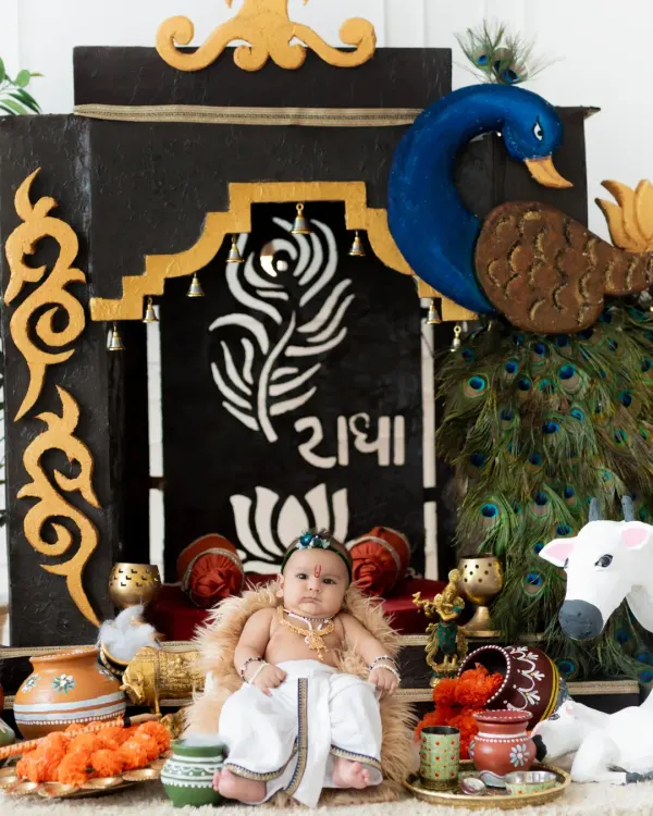 My custom-built Janmashtami set is ready for your little Krishna. The details, from the peacock to the 'Radha' inscription, make these photos truly special.