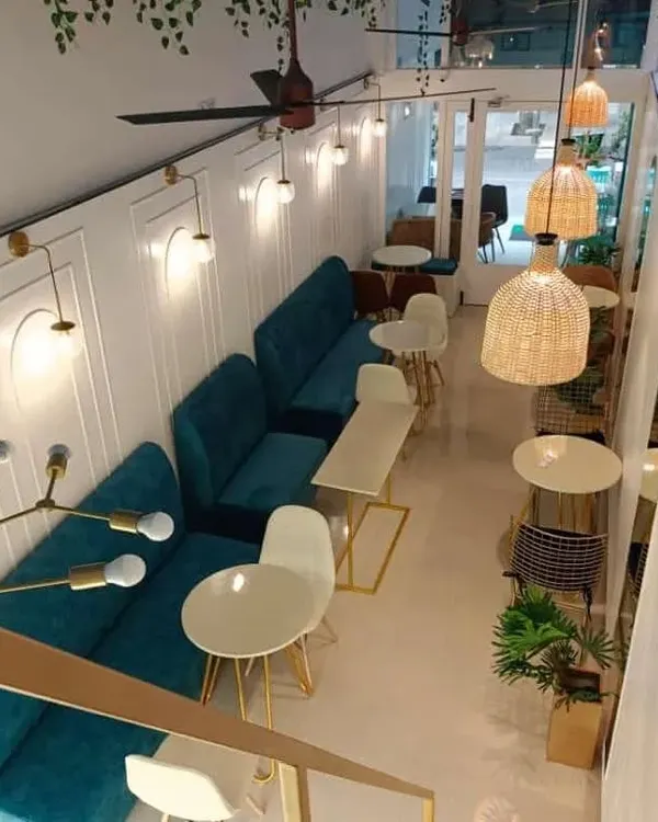 This top-down perspective reveals the complete layout of a modern cafe we designed. Notice how the long banquette seating maximizes space along one wall, while varied table arrangements create distinct zones for different group sizes.