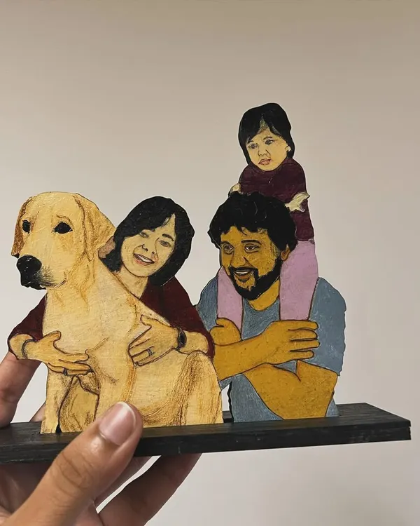 This custom wooden miniature features a full family, including their beloved golden retriever. It's a heartwarming, hand-painted piece that brings a digital illustration into the physical world.