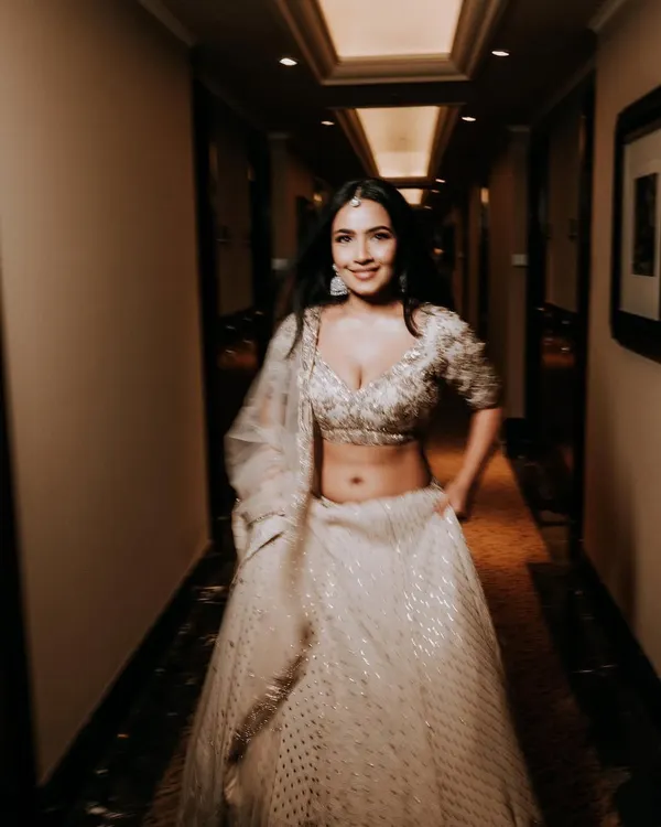 Shubhangi looking absolutely radiant and happy for her engagement. We went for a soft glam look with open hair to complement her stunning white Dolly J Studio lehenga.