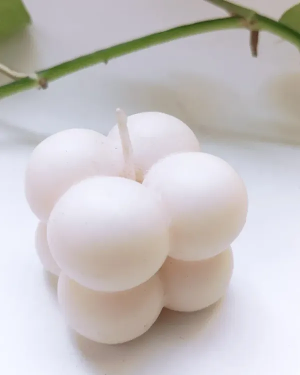 A close-up of my handcrafted soy wax bubble candle. Its unique, mesmerizing design makes it a stunning decor piece that creates a soothing ambiance in any room.