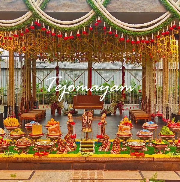 A breathtaking outdoor setup where the mandap is adorned with hanging floral garlands, creating a dreamy and elegant atmosphere for the ceremony.