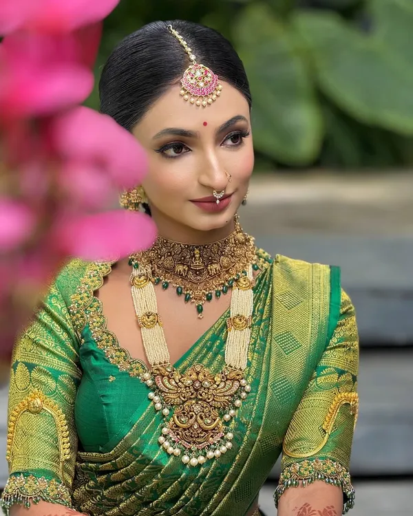 This is my signature South Indian bridal look. I focus on creating flawless, radiant skin that looks stunning in person and on camera, paired with classic eye makeup and bold lips that complement the rich silk saree and temple jewelry.