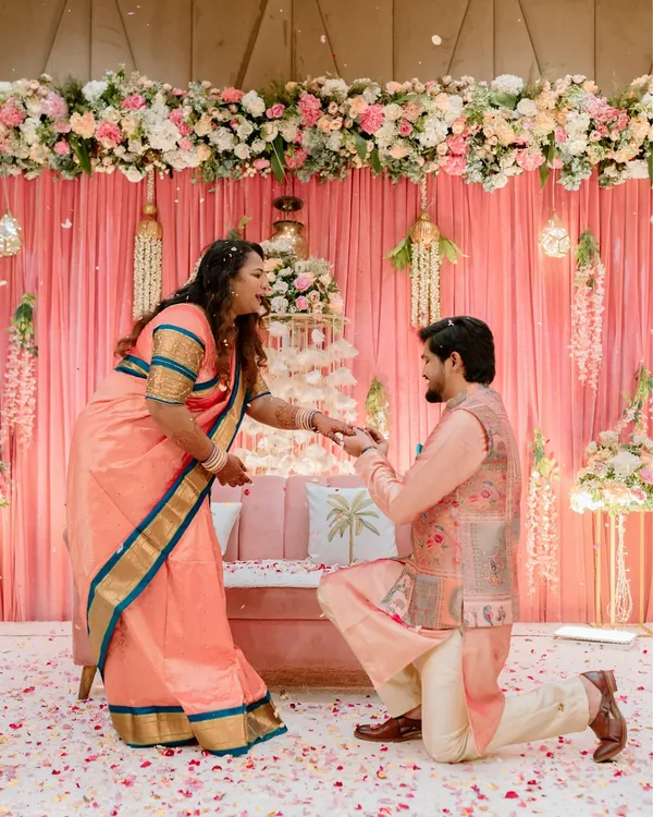 The big moment. Capturing the proposal during the ring ceremony, with flower petals showering down, is a memory to cherish forever.