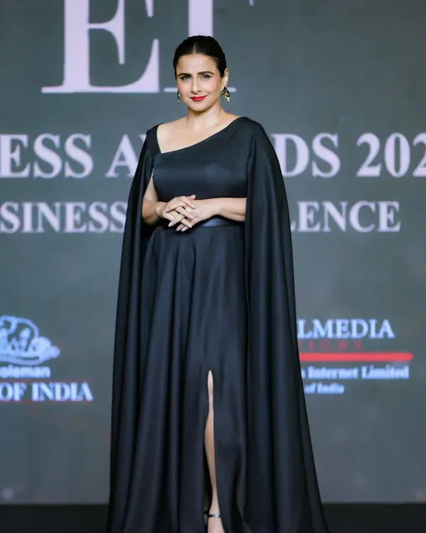 **(Hero Item)** We are experienced in covering high-profile events with prominent guests. Here, we captured a full-length portrait of actress Vidya Balan on stage at the ET Business Awards, showcasing our ability to deliver professional photos for prestigious award ceremonies.
