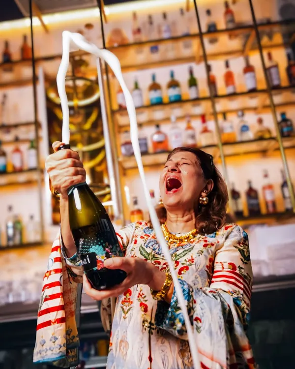 This shot captures the pure, chaotic joy I love to create on set. For this lifestyle shoot, we embraced a 'granny-core' theme with cocktails and poker, resulting in vibrant, story-rich visuals that feel alive and authentic.
