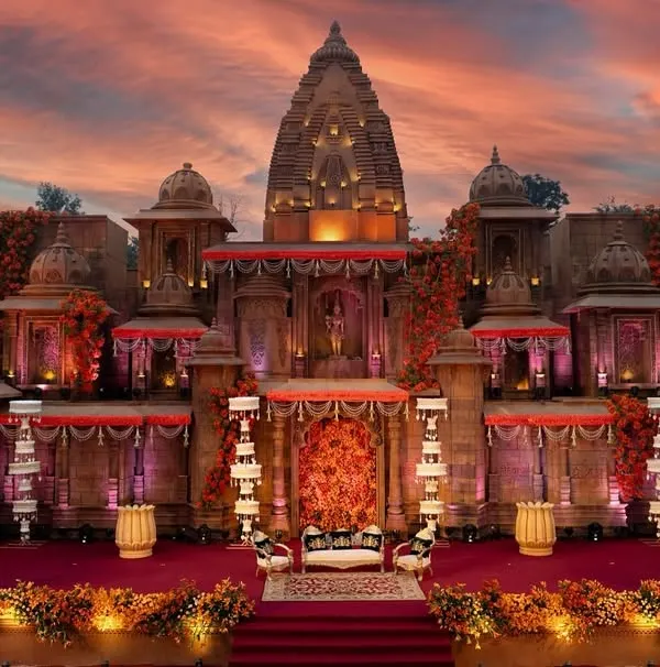 This is my signature 'Devaalaya' or 'Temple of Love' design. I recreated an entire ancient temple structure, complete with intricate carvings and a breathtaking sunset backdrop, to serve as a divine stage for a wedding ceremony.