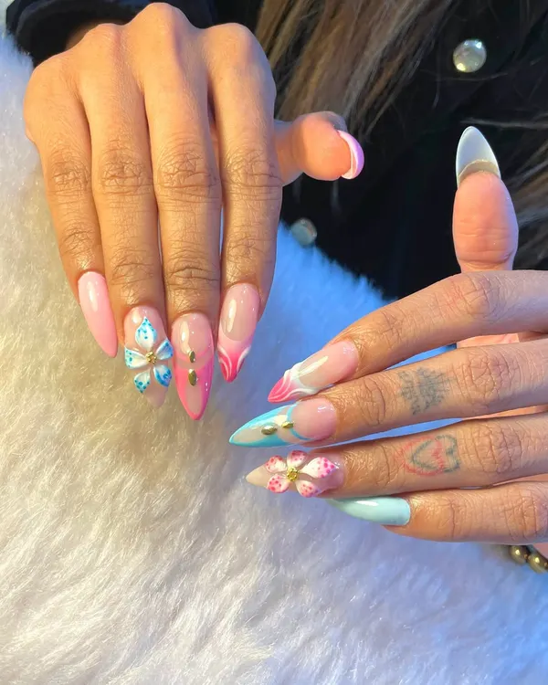 This set is all about playful dimension and color. We combined pastel pink and blue tones with sharp French tips and intricate 3D butterfly and flower charms for a look that's pure fantasy.