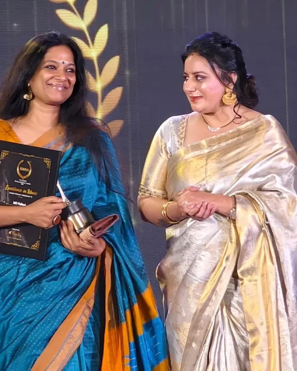 A candid moment on stage after receiving the Karnataka Women Achievers' Award for Excellence in Music. I am filled with gratitude for this recognition.