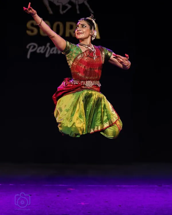 A moment of elevation during the Soorya Parampara Festival. For me, Bharatanatyam is not just about staying grounded; it's also about finding that split second of flight. This dynamic Nritta pose captures the physical rigor and energy that is central to my body conditioning workshops.