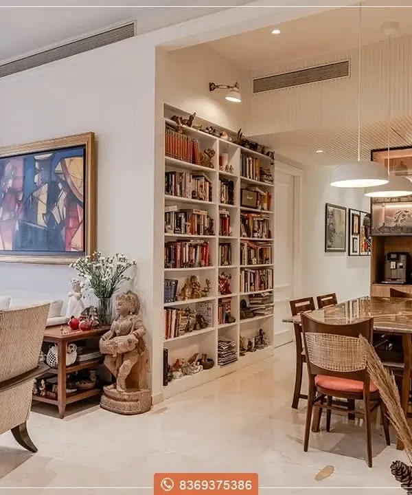 We believe a home should be a complete expression of your story. This living and dining space is a testament to that philosophy, where we integrated a custom floor-to-ceiling library, a bespoke dining set with rattan chairs, and coordinated living room furniture to create a seamless, sophisticated environment that is both beautiful and deeply personal.