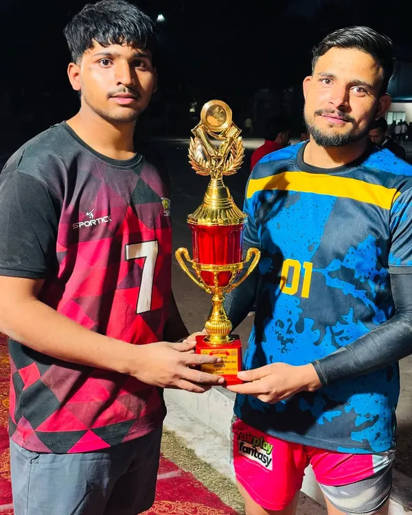Our players holding the winner's trophy after securing the first position in a tournament in Meerut.