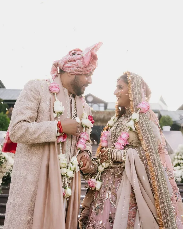 These aren't just pictures; they are moments that prove such love still exists. This couple's coordinated pastel outfits from Marwar Couture and Anita Dongre create a look of soft, romantic elegance.
