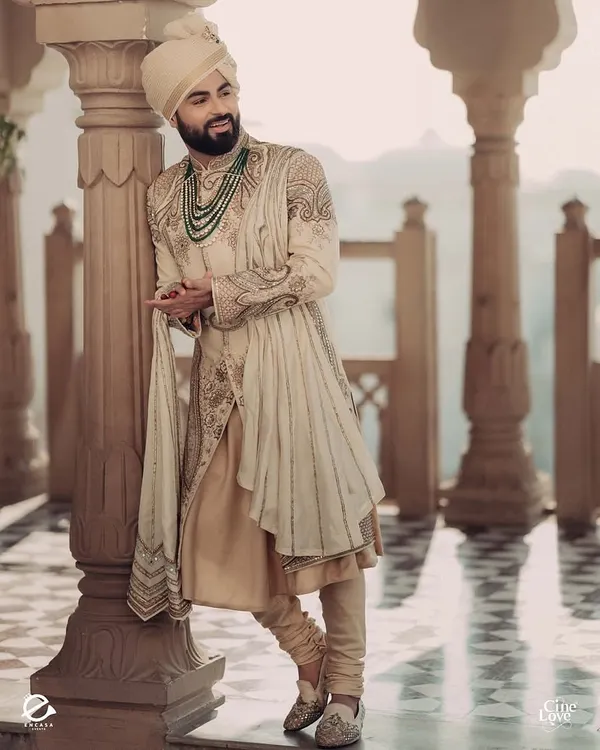 A portrait of groom Bismil looking effortlessly royal in his ivory sherwani by Sulakshana Monga. I added a multi-layered emerald necklace to bring a touch of color and grandeur.