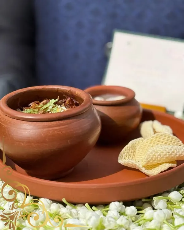 My dum biryani is slow-cooked and served in traditional terracotta pots. This method not only looks beautiful but also seals in the authentic, soulful flavors of the dish.