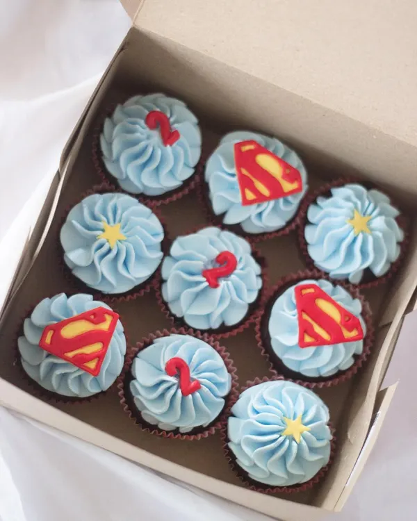 It's a bird, it's a plane, it's Superman cupcakes! These were for a superhero-themed birthday party, complete with the iconic 'S' logo and little number '2' toppers. These are always a huge hit with the kids.