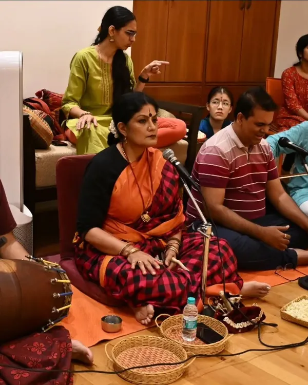 As a guru, I am deeply involved in every aspect of the arangetram, including conducting the nattuvangam during rehearsals. This is a candid moment from the music session for Anvita Jain's performance.