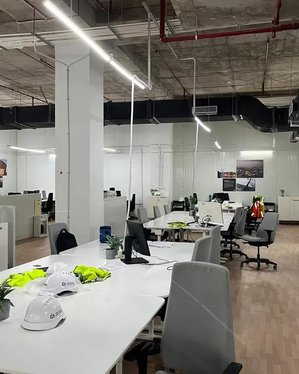 A view of the main open-plan workspace from our completed IKEA project. This photo shows the final installed workstations, collaborative tables, and integrated storage solutions, all part of our comprehensive interior execution.