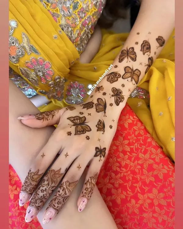 A beautiful and modern design featuring a flight of butterflies up the arm. This style is light, elegant, and perfect for someone wanting a non-traditional look.