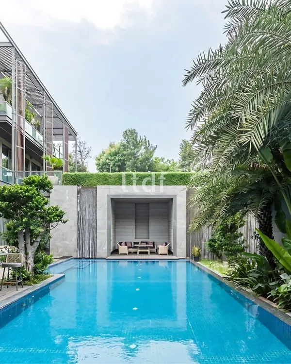 Villa Nova, a 30,000 sq. ft. luxury residence, showcases a striking architectural design that merges indoor and outdoor spaces. Its sleek exterior features expansive glass panels, filling interiors with natural light and offering beautiful views of the pool and surrounding landscape.