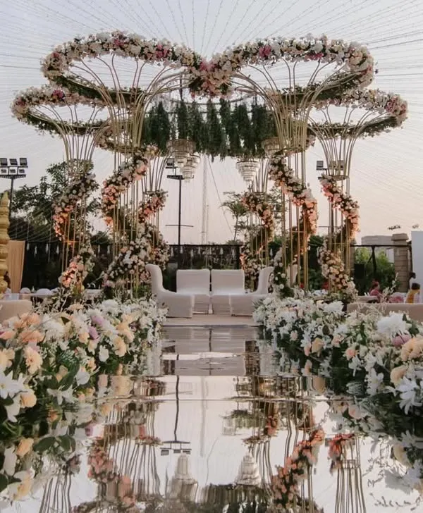 This is the canvas where your forever begins. I designed this grand pastel mandap with cascading florals and a mirrored aisle to feel like stepping into a real-life fairytale, perfect for an unforgettable outdoor wedding ceremony.