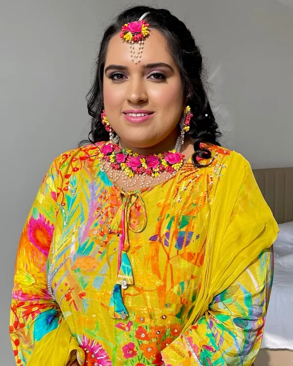 A close-up of this radiant Haldi bride. I used minimal makeup with pink lids and a touch of blush to create a natural, ethereal look.