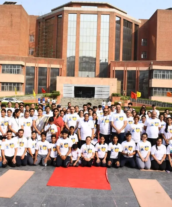 A wonderful group photo from a 'Yogotsav' event I led for a large organization. I am equipped to handle the logistics and instruction for massive corporate wellness events, ensuring a seamless and impactful day for all attendees.
